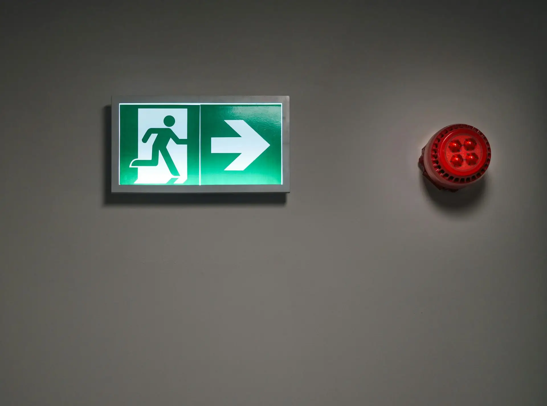 Illuminated exit signs and emergency lighting